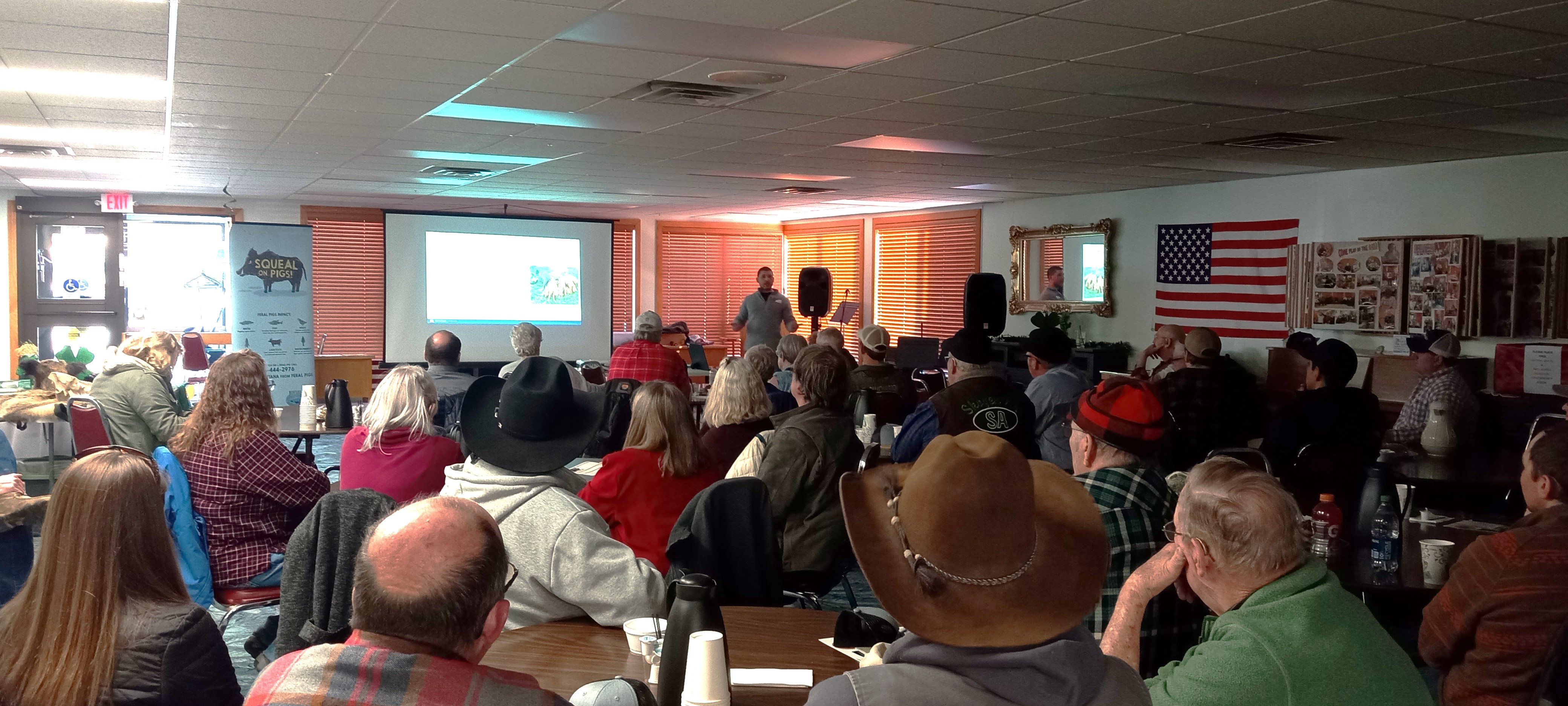 A packed house of producers and interested citizens listen intently during the feral hog workshop.